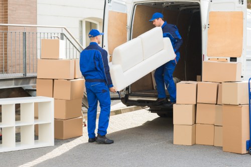 Household removal service preparing boxes and furniture for a Kennington flat move