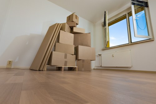 Sustainable moving team planning recycling and reuse during a Kennington relocation