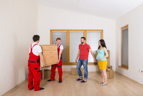 Professional movers loading household items for a Kennington relocation