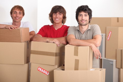 Careful wrapping of fragile household items during a local packing service