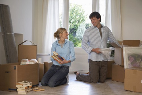 Moving team unloading boxes at a Kennington property