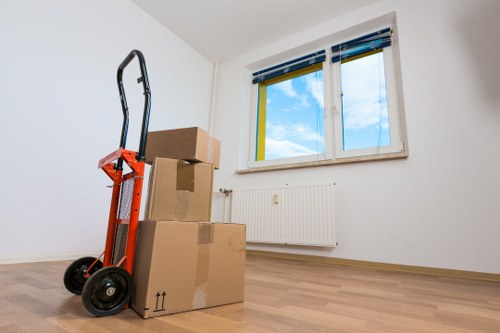 Staff handling moving boxes with care during a removal