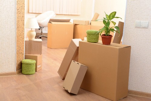 Packed office boxes and furniture ready for transport