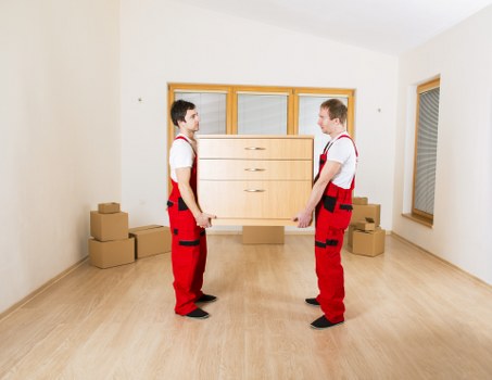 Professional movers handling boxes during a Kennington relocation